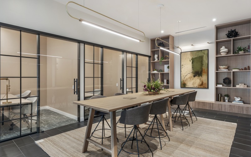 Modern coworking space at 75 Tresser in Stamford, CT, featuring high-speed Wi-Fi, private seating, and community work tables.