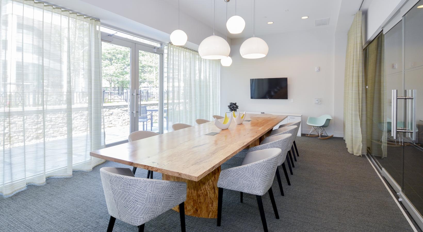 Access to resident-only features large meeting room with long wooden table